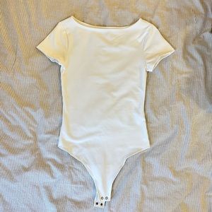 Chic boat neck white bodysuit